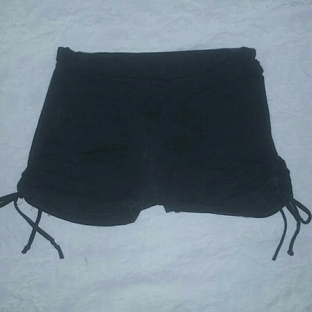 Dark grey shorts with ties.